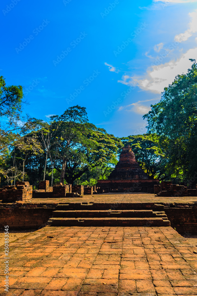 Lanka style ruins pagoda of Wat Mahathat temple in Muang Kao Historical Park, the ancient city of Phichit, Thailand. This tourist attraction is public historic site and free admission.