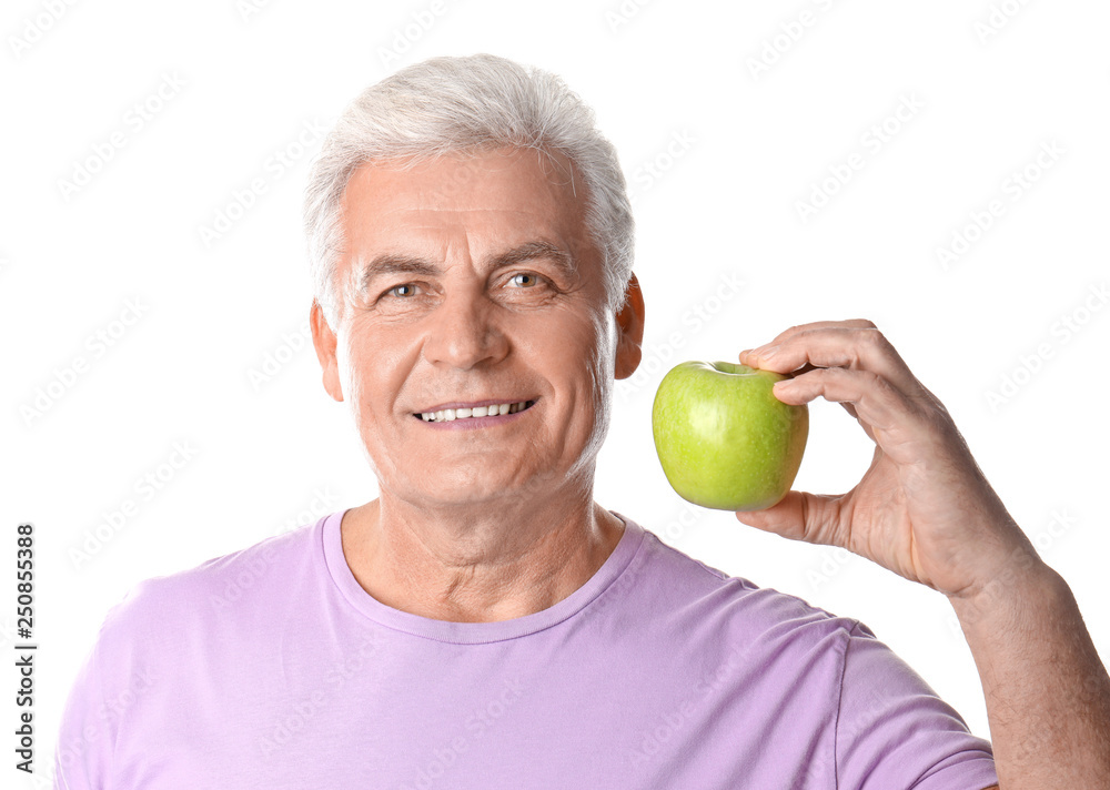 Mature man with healthy teeth and apple on white background Mature man with healthy teeth and apple on white background