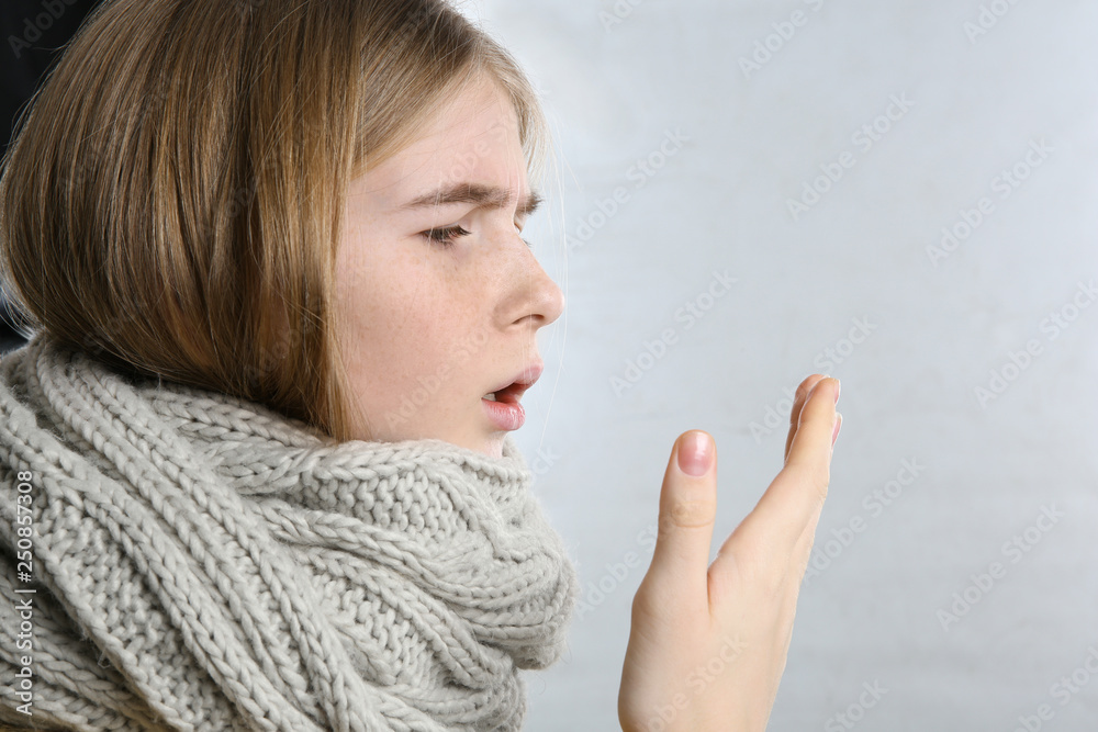 Teenage girl suffering from cough isolated on white Teenage girl suffering from cough isolated on white