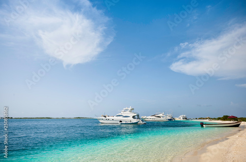 Yachts anchored near de beach in a beautiful place  Los Roques National Park  during a sunny day