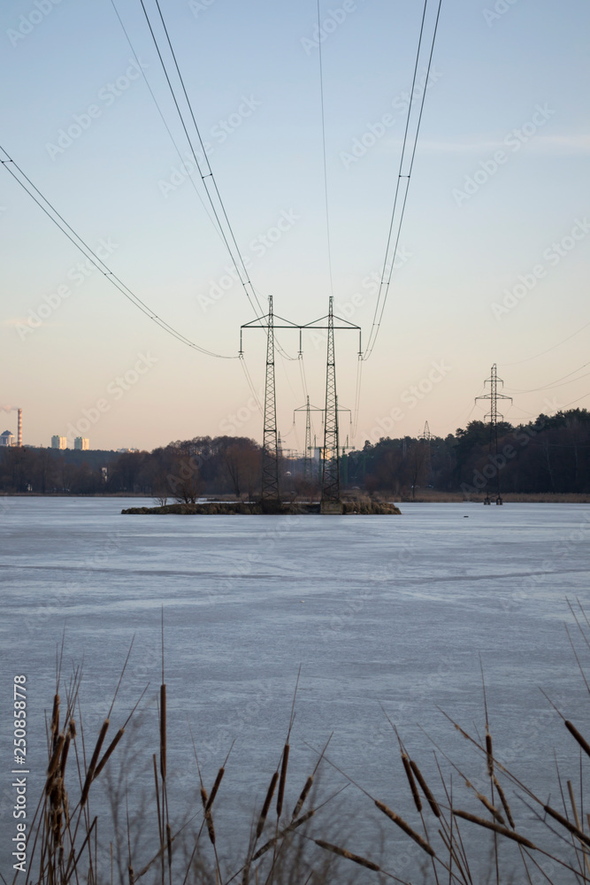 Electric towers on a island on the lake.