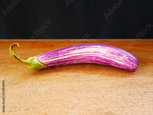 organic eggplant on wood background photo