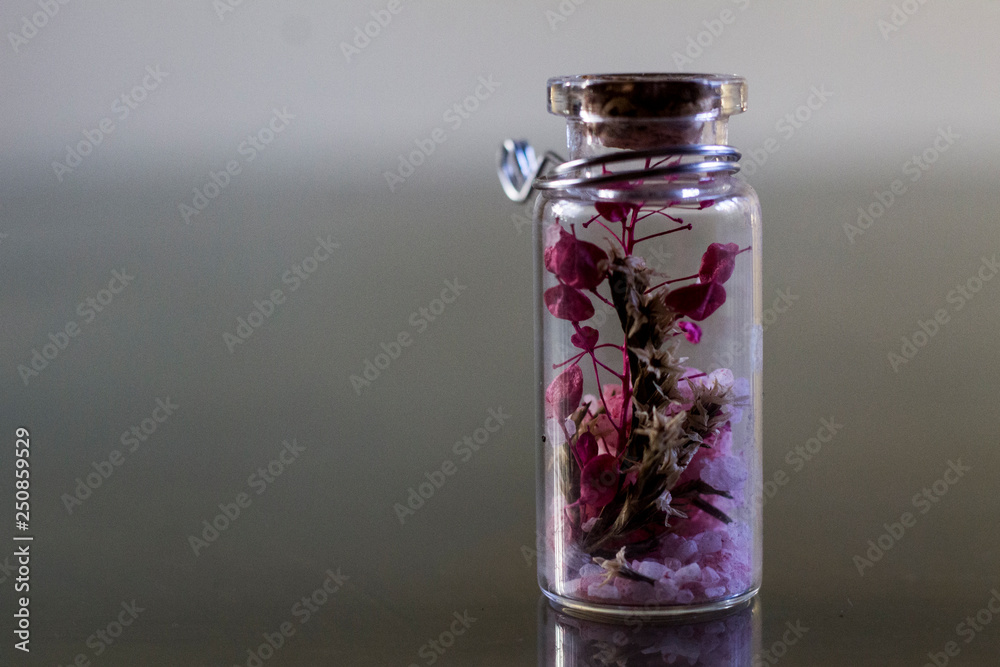 flowers inside tiny jar. flowers inside tiny jar.