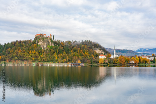 Beautiful autumn landscape around Lake Bled with the castle and St. Martin's Parish Church