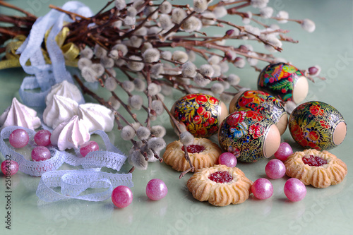 Easter eggs with sweets and willow branches.Easter holiday card.