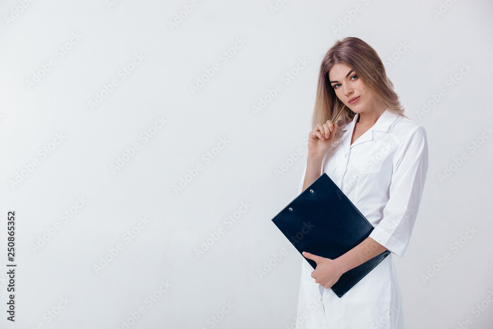 Medical physician doctor woman in white coat holds folder with documents on light background. Medical physician doctor woman in white coat holds folder with documents on light background.