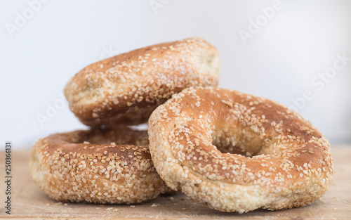Montreal sesame seed bagels are shown on a cutting board