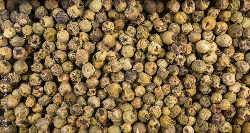 green pepper peppercorns background. Natural seasoning texture.