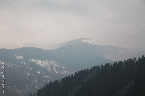 Winter landscape in the Carpathian mountains  with gutsul culture. photo