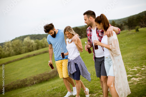 Happy group of friends having fun and smiling at nature