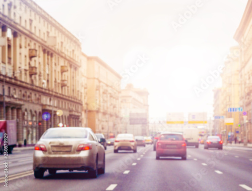 Blur cars on the road with smooth traffic at junction area. Cars stop beside road and light © Irina Sokolovskaya