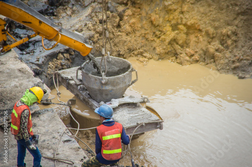 Fényképezés Wet concrete pour or pump from the concrete lorry into the bore pile casing