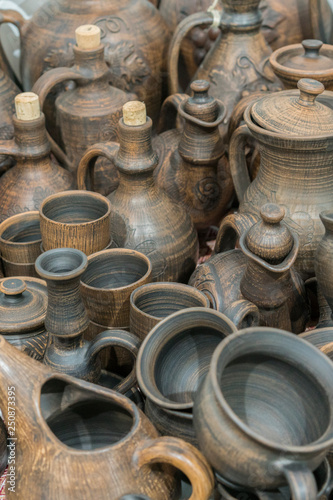 Clay dishes. Ceramic national Ukrainian dishes made in the Poltava region in the village of Opishnya and demonstrated at the in Velyki Sorochyntsi Fair. Burnt black ceramics. Burned clay jars