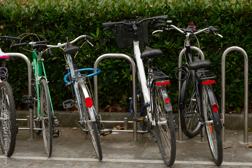 Bicycles parked and locked in different places in the center of the city of Vitoria-Gasteiz (Alava) Basque Country, Spain.