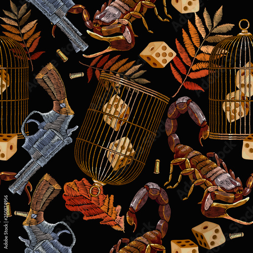 Embroidery autumn leaves, scorpion, vintage guns and golden cage seamless pattern. Halloween template for clothes, t-shirt design. Classical gothic art