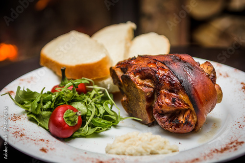 roasted pork knuckle with bread and horseradish