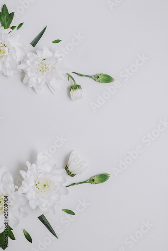 Flowers composition. Wreath made of white flowers on white background. Spring and summer concept. Flat lay, copy space