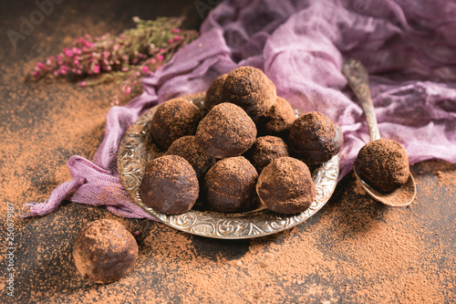 Homemade chocolate truffle on dark background