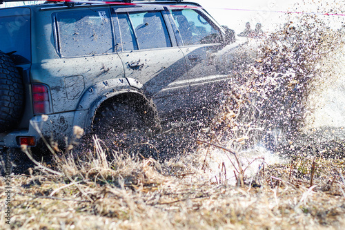 Ukrainian offroad competition in the city of Kamyanets Podilsky. Swamp and mud on cars. Produce large puddles