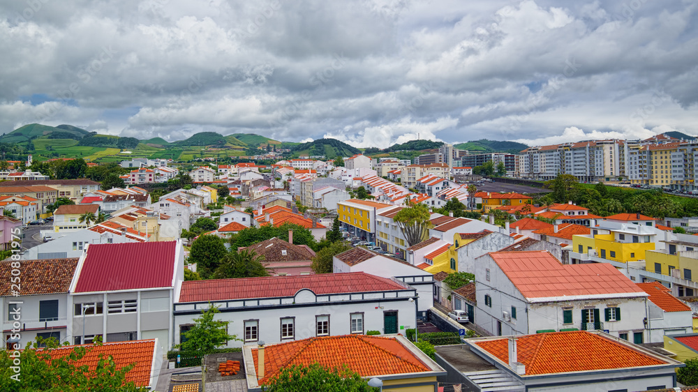Rainy clouds above the Ponta Delgada city, located on Sao Miguel island of Azores, Portugal.