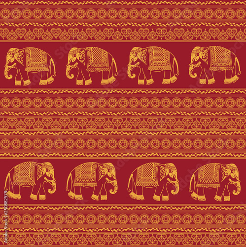 Indian traditional pattern with elephants on red background. Seamless pattern