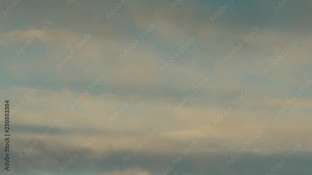 Russia, time lapse. Formation and rapid movement of white clouds of different shapes in the blue sky in late spring at sunset. Russia, time lapse. Formation and rapid movement of white clouds of different shapes in the blue sky in late spring at sunset.