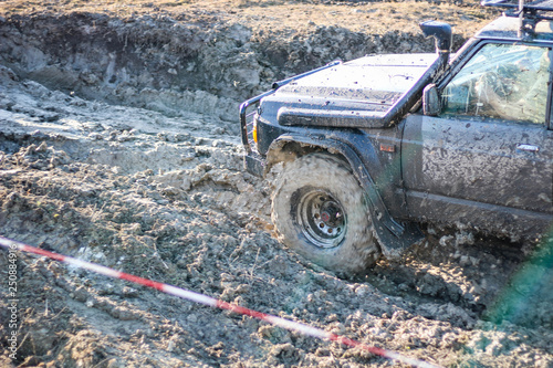 Ukrainian offroad competition in the city of Kamyanets Podilsky. Swamp and mud on cars. Produce large puddles