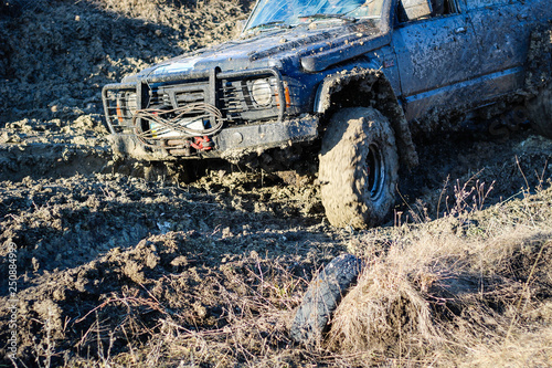 Ukrainian offroad competition in the city of Kamyanets Podilsky. Swamp and mud on cars. Produce large puddles