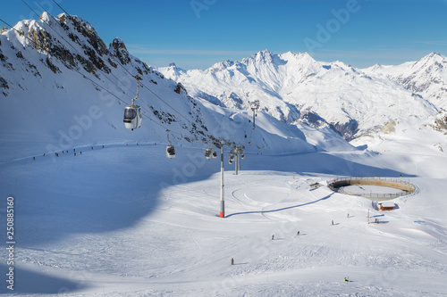 Gondolas of a cable car in the popular ski resort Les Arcs in French Alps.