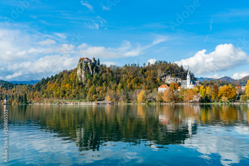 Beautiful autumn landscape around Lake Bled with the castle and St. Martin's Parish Church photo