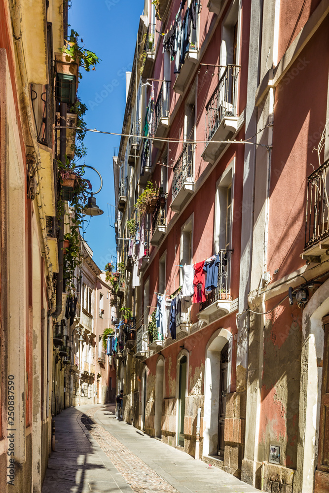 Narrow medieval streets of the old town of Cagliari, capital of Sardinia, Italy