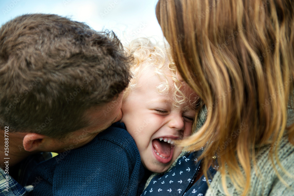 Parents with happy daughter (2-3) 