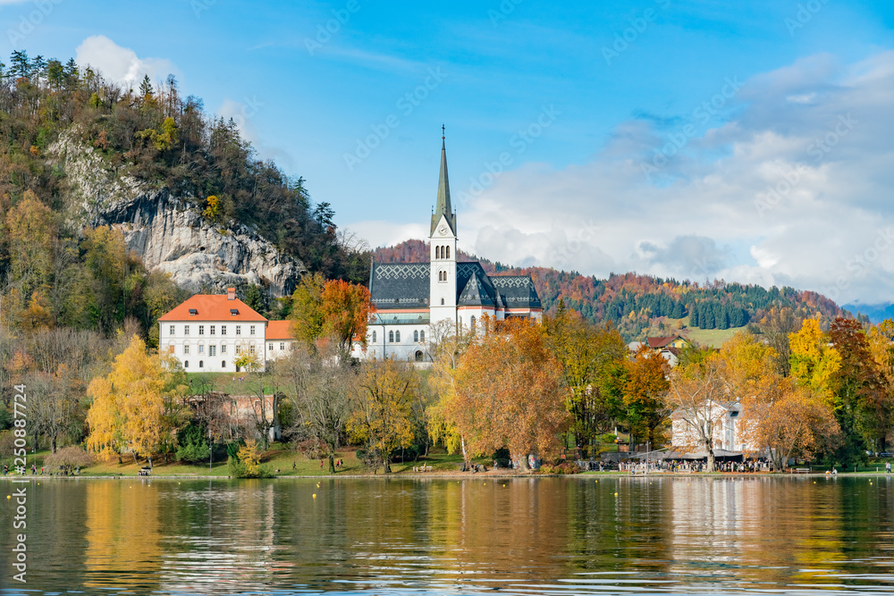 Beautiful autumn landscape around Lake Bled with St. Martin's Parish Church
