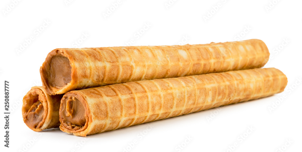 Waffle tubes with condensed milk on a white background. Isolated. Waffle tubes with condensed milk on a white background. Isolated.