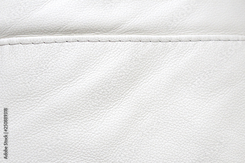 Natural leather white texture background. Macro. Vintage fashion background for designers and composing collages. Luxury textured genuine leather of high quality.