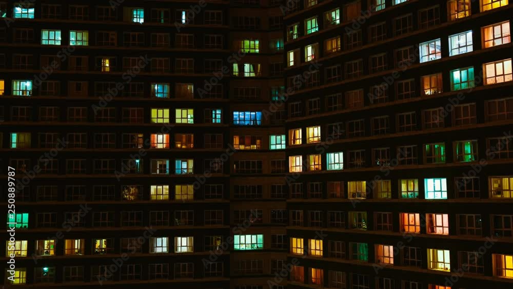 Light in the windows of a multistory building. Time lapse Light in the windows of a multistory building. Time lapse
