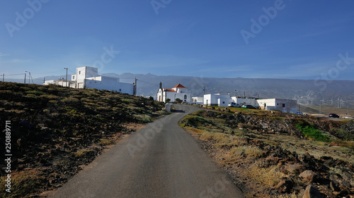 Empty road cutting through the arid volcanic lanscape of Tenerife island, road from Faro Punta de Abona approaching the village Poris de Abona, in Arico municipality, Tenerife, Canary Islands, Spain  © Ana