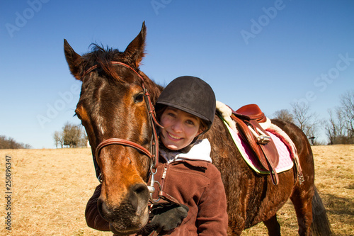 Portrait of teenage girl with horse  photo