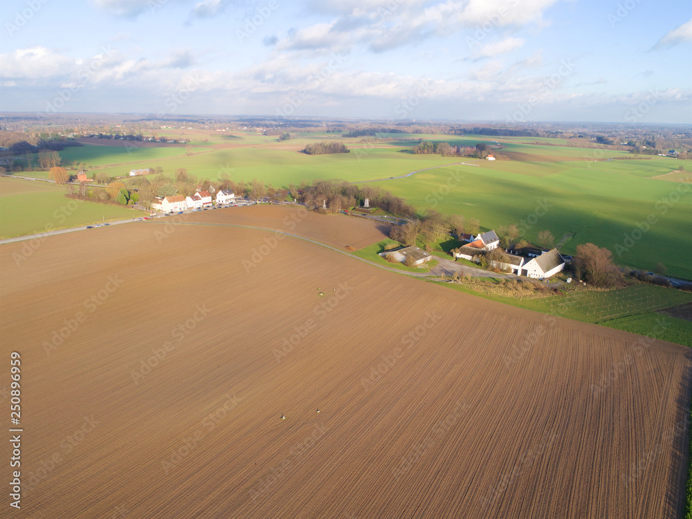 Obraz premium Aerial view of Battle field, Napoleon, Lion's Mound, Waterloo, Belgium, Green farm field during autumn season.