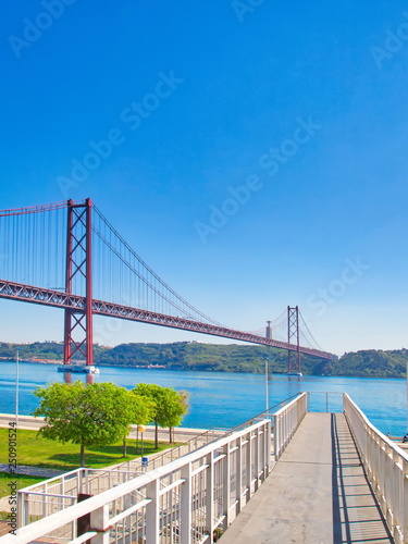 Lisbon, Portugal-October 17, 2017: Landmark suspension 25 of April bridge over Tagus River in Lisbon