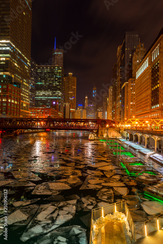 Chicago Riverwalk with big chunks of ice floating in the river after cold days, Chicago IL 2019