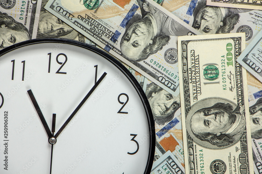 One hundred dollar bills and a white big clock, concept, time is money background
