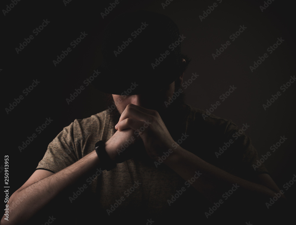 Portrait of handsome fighter performing hand salute on darkling background Portrait of handsome fighter performing hand salute on darkling background