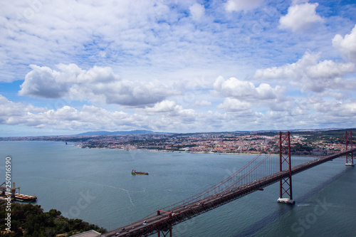 Panoramic view of Ponte 25 de Abril, long bridge in Lisbon © Tomtsya