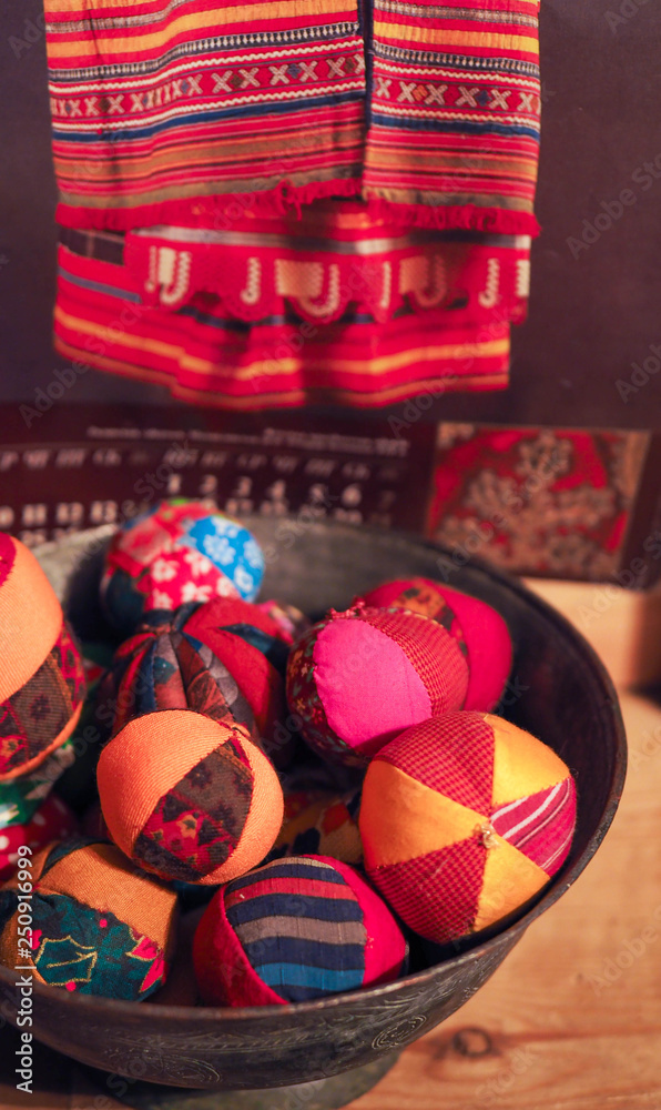 Fototapeta premium patchwork toy balls lie in the basket. Russian traditional