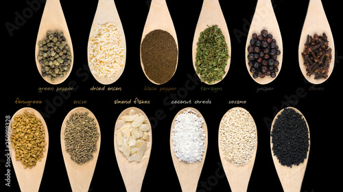 Set of various spices and food ingredients with labels isolated on black background. High resolution