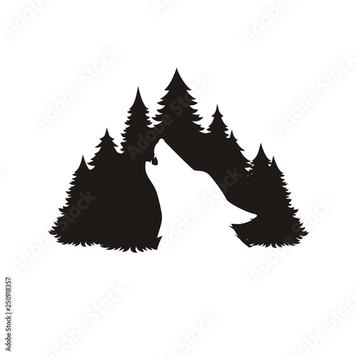 Silhouette of a wolf on the background of the forest