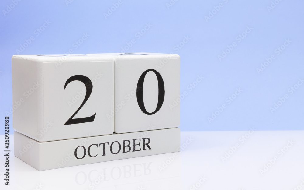 October 20st. Day 20 of month, daily calendar on white table with reflection, with light blue background. Autumn time, empty space for text October 20st. Day 20 of month, daily calendar on white table with reflection, with light blue background. Autumn time, empty space for text