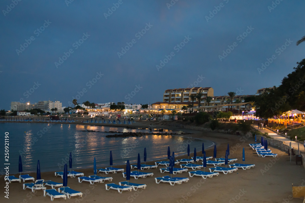 PERNERA, CYPRUS - JUNE 16: Night walking along wharf near Louma Beach at in Pernera, Cyprus on June 16, 2018. 