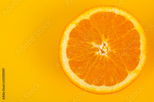 Two halves of cut orange, top view.